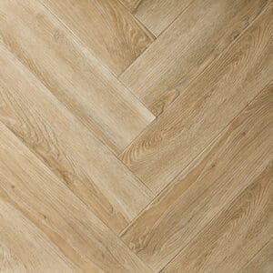 Close-up of Textures LVT Washed Oak Herringbone TH04 luxury vinyl flooring showing the herringbone pattern.