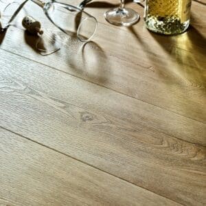 Textures LVT Washed Oak Plank TP04 installed floor with champagne and party favors