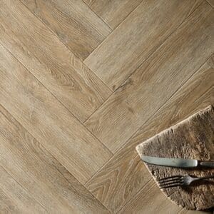 Textures LVT Weathered Oak Herringbone TH05 flooring detail showing the herringbone pattern.