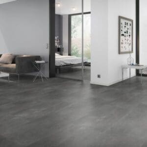 Spacious contemporary living area with dark grey stone effect vinyl tiles