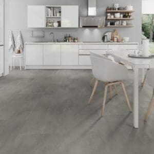 Bright white kitchen and dining space with Cement Natural grey vinyl tiles