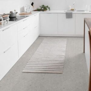 Modern kitchen featuring Cement Terrazzo Beige vinyl tile flooring and white cabinetry