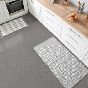 Modern kitchen featuring Cement Terrazzo Grey vinyl tile flooring and white cabinetry