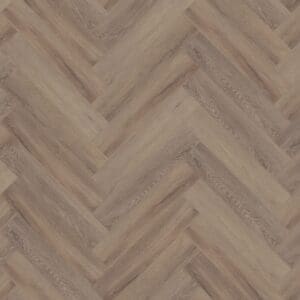 Close up of Cerused Oak Dark Natural Herringbone luxury vinyl flooring showing the intricate wood grain and parquet pattern.