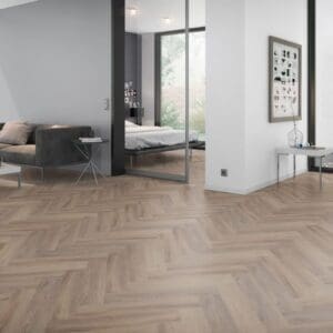 Modern living room and bedroom area featuring Cerused Oak Dark Natural Herringbone flooring throughout.