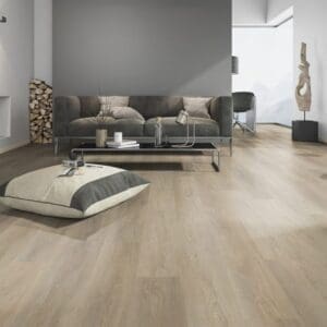 French Oak Natural flooring installed in a modern grey living room with a dark sofa