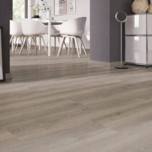 Dining area with white chairs and Noble Oak Greige wood effect flooring