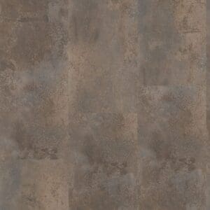 Close up of One Flor Home 30 Oxyde Rust luxury vinyl tiles showing industrial stone pattern