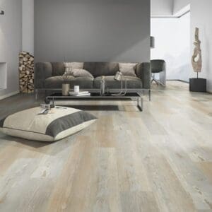 Modern living room featuring One Flor Home 30 Painted Wood Natural flooring with grey sofa