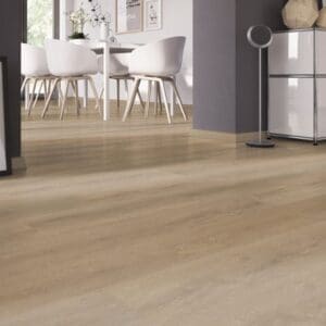 Dining area with white chairs and Sawcut Oak Dark vinyl flooring showcasing a seamless glue down finish.
