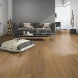Modern living room setting featuring Tyrol Oak Honey luxury vinyl flooring with contemporary furniture.