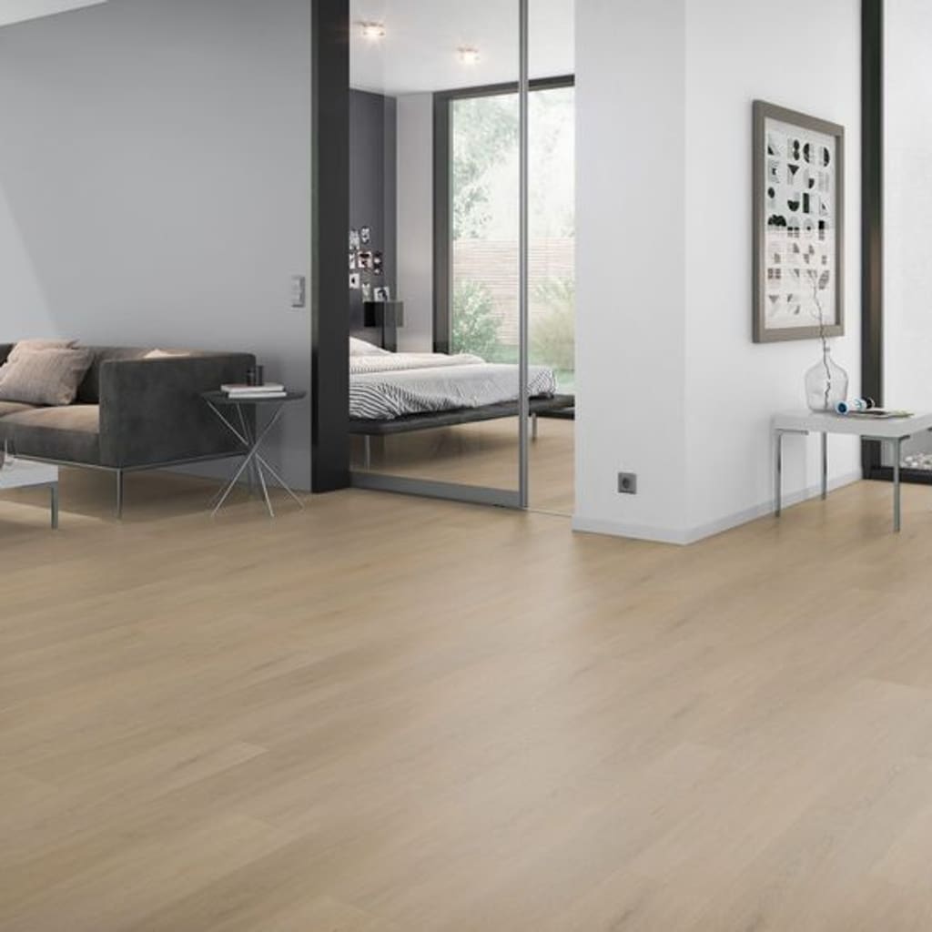Spacious living area with natural oak effect vinyl plank flooring