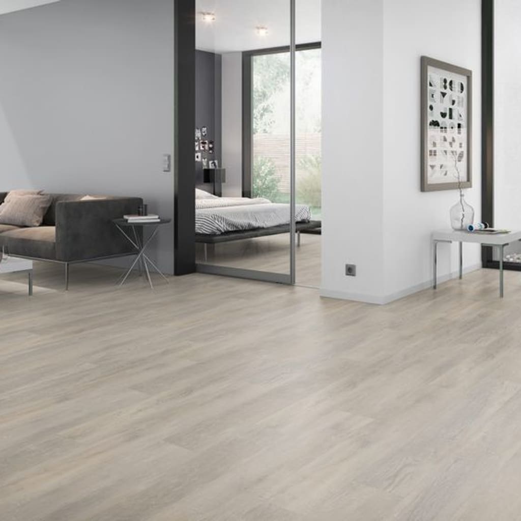 Spacious living area with light beige wood effect vinyl flooring