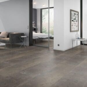Modern living room interior featuring Oxyde Brown stone effect flooring with contemporary furniture