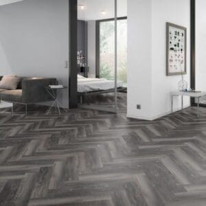 Modern living room interior featuring Smoked Pine Black Herringbone flooring