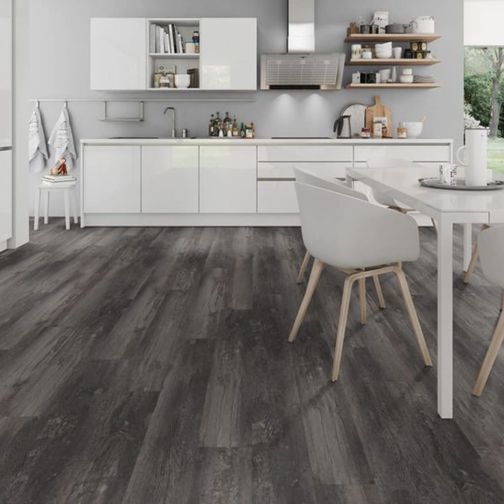 Modern white kitchen featuring Smoked Pine Black luxury vinyl flooring