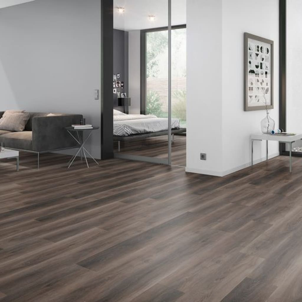 Contemporary living room and bedroom area with dark brown walnut vinyl planks