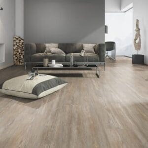 Modern living room featuring Prestige Oak Natural flooring with contemporary grey furniture.