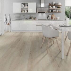 Bright kitchen and dining space installed with Prestige Oak White wood effect planks