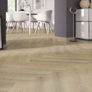 Dining area with white chairs and Sawcut Oak Natural Herringbone flooring
