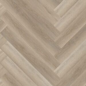 Close up of Soft Oak Greige Herringbone luxury vinyl flooring sample showing wood grain detail