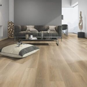 Modern living room featuring Soft Oak Natural flooring with a grey sofa and minimalist decor