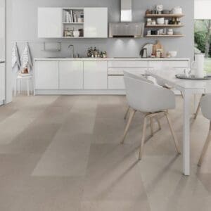 Urban Beige stone effect flooring installed in a bright modern kitchen with white cabinetry.