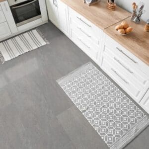 Contemporary kitchen with Waystone Grey vinyl tiles and white cabinetry