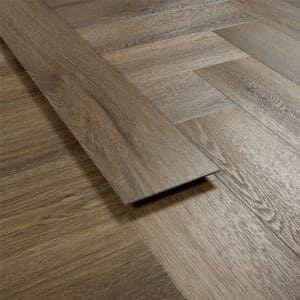 Profile view of an Antique Walnut vinyl plank showing thickness and texture