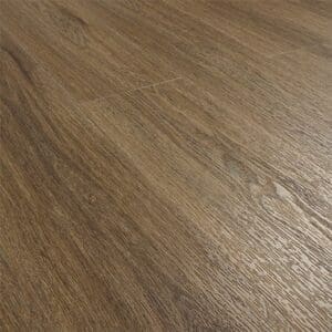 Angled view of installed Antique Walnut flooring showing the surface sheen and texture