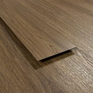 Side profile of a single Antique Walnut vinyl plank showing the 2.5mm thickness