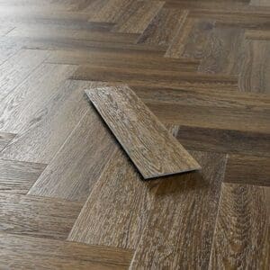 Close up of a single Abingdon Mosaic Antique Walnut plank showing wood grain texture