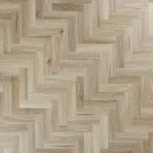 Top down view of Abingdon Mosaic Smoky Oak luxury vinyl tiles in a herringbone pattern.