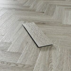 Close up of a single Abingdon Mosaic Urban Grey plank showing wood grain texture