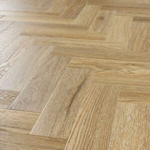 Angled perspective of installed Abingdon Mosaic Weathered Cedar herringbone flooring