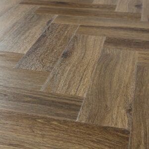Angled view of installed Abingdon Tapestry Antique Walnut herringbone flooring