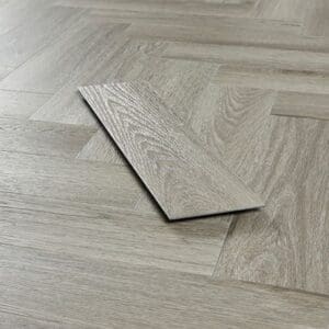 Close up of a single Abingdon Tapestry Urban Grey plank showing wood grain texture