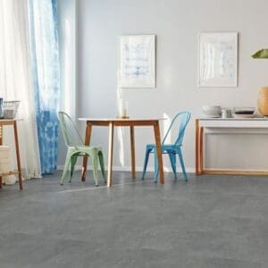 Atlantic Slate flooring installed in a modern dining room with contemporary furniture.