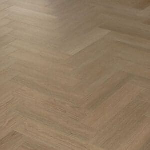 An angled perspective of the Bridle Oak flooring highlighting the realistic wood grain texture and herringbone layout.