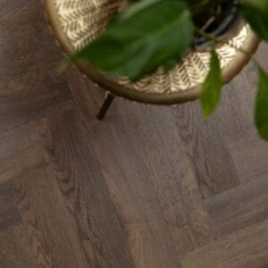 Burnt Fig Herringbone LVT flooring in a well lit room setting