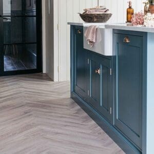 Wide view of Earl Grey Herringbone flooring in a kitchen setting