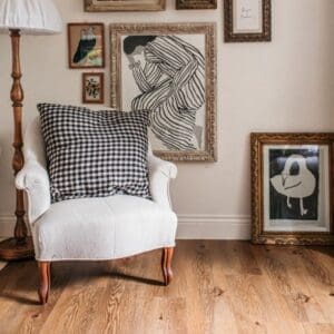 Close up of Harvey Maria Fumed English Oak luxury vinyl tile showing natural wood grain texture