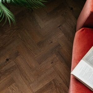 Close up of the wood grain texture on a Fumed English Oak LVT plank