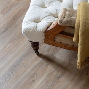 Harvey Maria Brindle Plank wood effect flooring in a kitchen leading to a pantry with checkerboard tiles