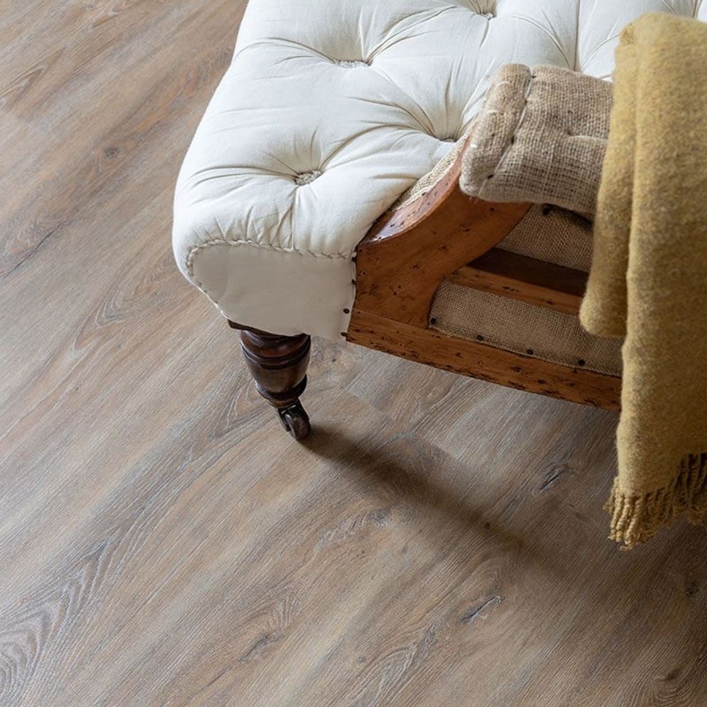 Harvey Maria Brindle Plank wood effect flooring in a kitchen leading to a pantry with checkerboard tiles
