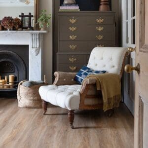 Harvey Maria Brindle Plank flooring in a traditional living room with fireplace and antique furniture