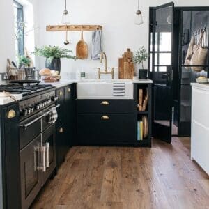 Harvey Maria Coppice flooring in a modern kitchen with black cabinetry