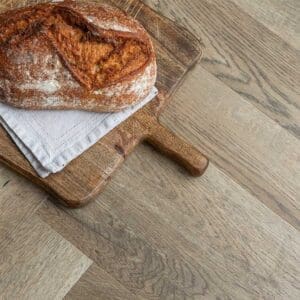 Close up detail of the wood grain texture on Cord Herringbone luxury vinyl tile