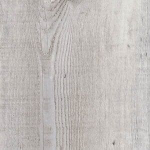 Harvey Maria Driftwood Plank installed in a rustic living room with a grey sofa and wooden table