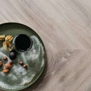 Close up sample of Earl Grey Chevron wood effect luxury vinyl tile